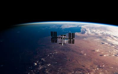 Cover image for research topic "The Impact of the Space Environment on Microbial Growth and Behavior"